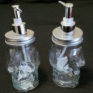Pair of Glass Skull Soap Dispensers
